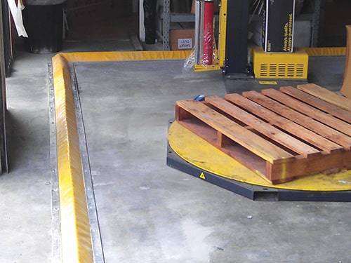 Chatoyer Flexible Floor Bund installed Yellow PVC Flexible Floor Bunding installed in workshop / warehouse