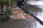 Weed and Debris Boom in stormwater canal Weed and Debris boom in stormwater canal during high flows