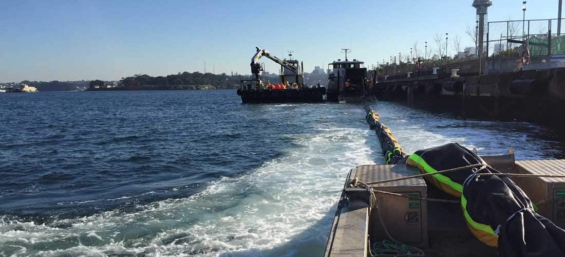 Chatoyer silt curtain deployment towing furled turbidity boom out for deployment