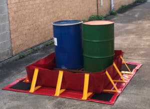chatoyer collapsible portable containment bund red PVC containing 2 drums. Deployed with Ground Mat and Liner. This collapsible bund contains 2 drums of chemical. If the drums leak, the bund will contain the leak and prevent pollution. chatoyer collapsible portable containment bund red PVC containing 2 drums. Deployed with Ground Mat and Liner. This collapsible bund contains 2 drums of chemical. If the drums leak, the bund will contain the leak and prevent pollution.